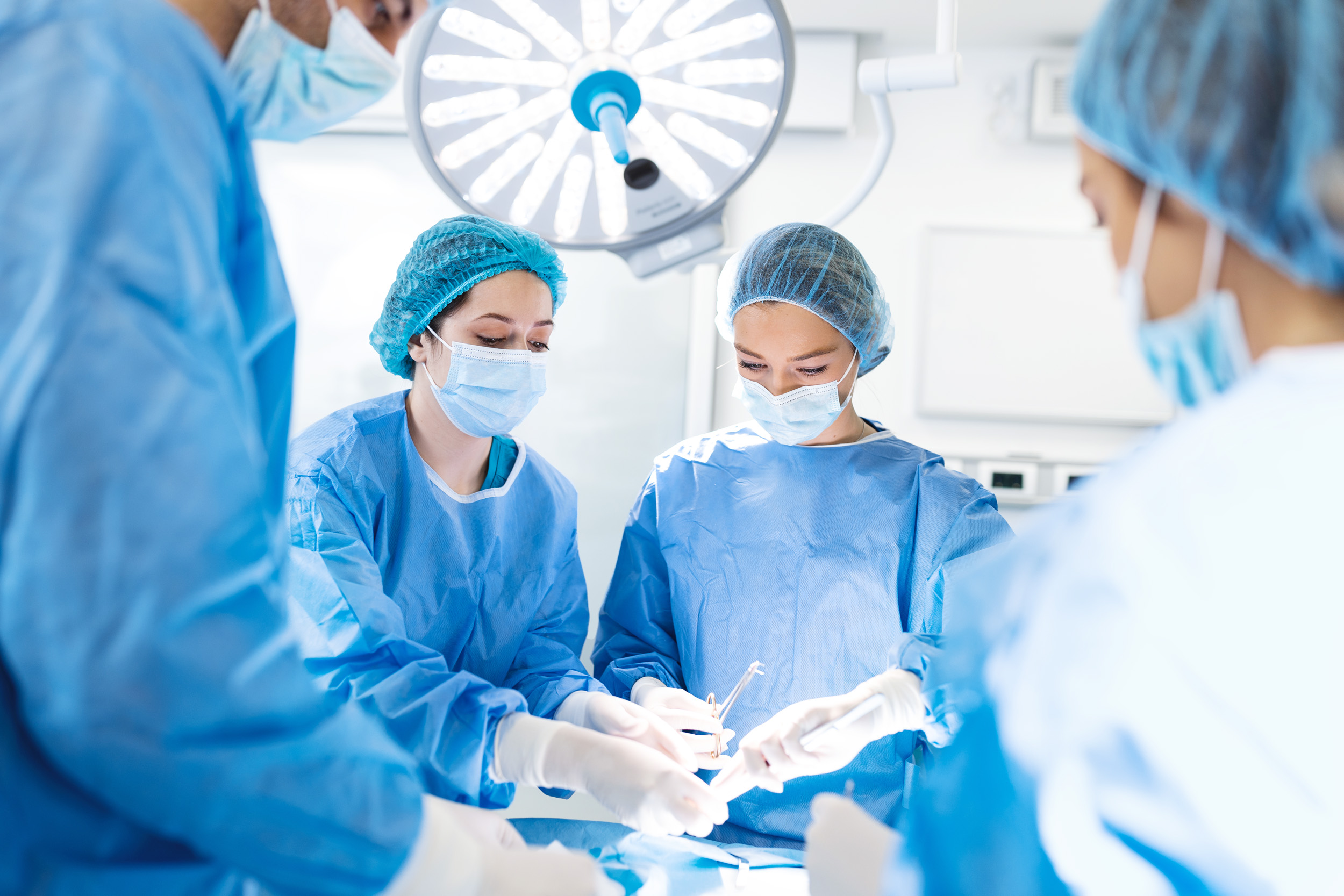 Doctor and assistant nurse operating for help patient from dangerous emergency case .Surgical instruments on the sterile table in the emergency operation room in the hospital.Health care and Medical